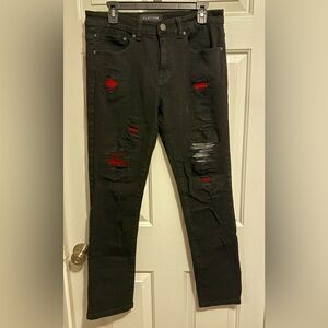 Stylish Black Relaxed Jeans with Red Distressed Details
